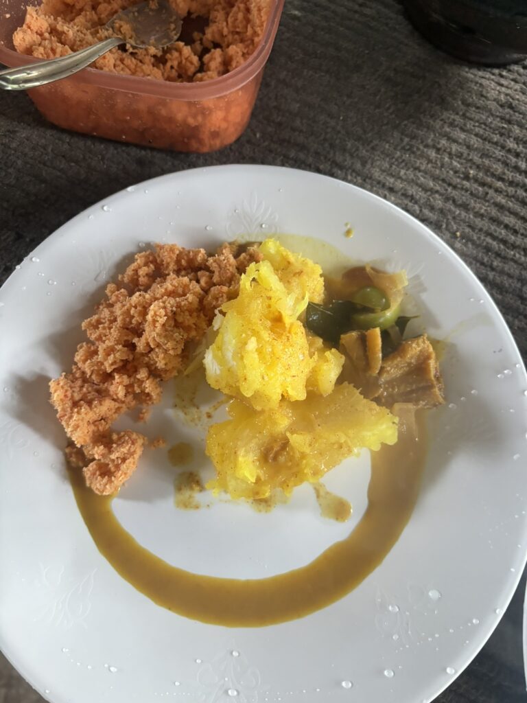 Boiled cassava with pol sambol and dried fish curry